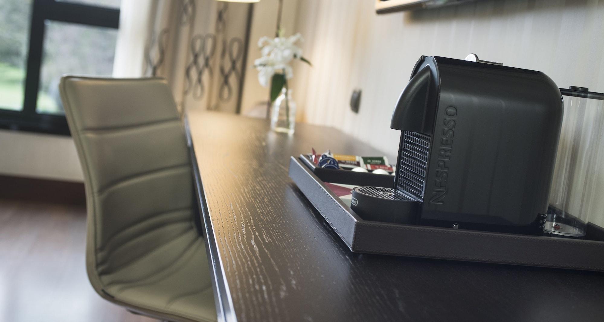 Palacio De Aviles Affiliated By Melia Bagian luar foto A Nespresso machine in a hotel