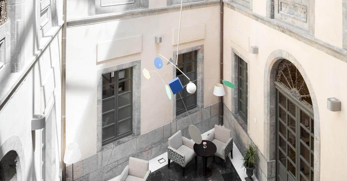 Palacio De Aviles Affiliated By Melia Bagian luar foto The mobile in the lobby of the National Gallery of Greece